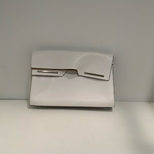 Woman’s white clutch